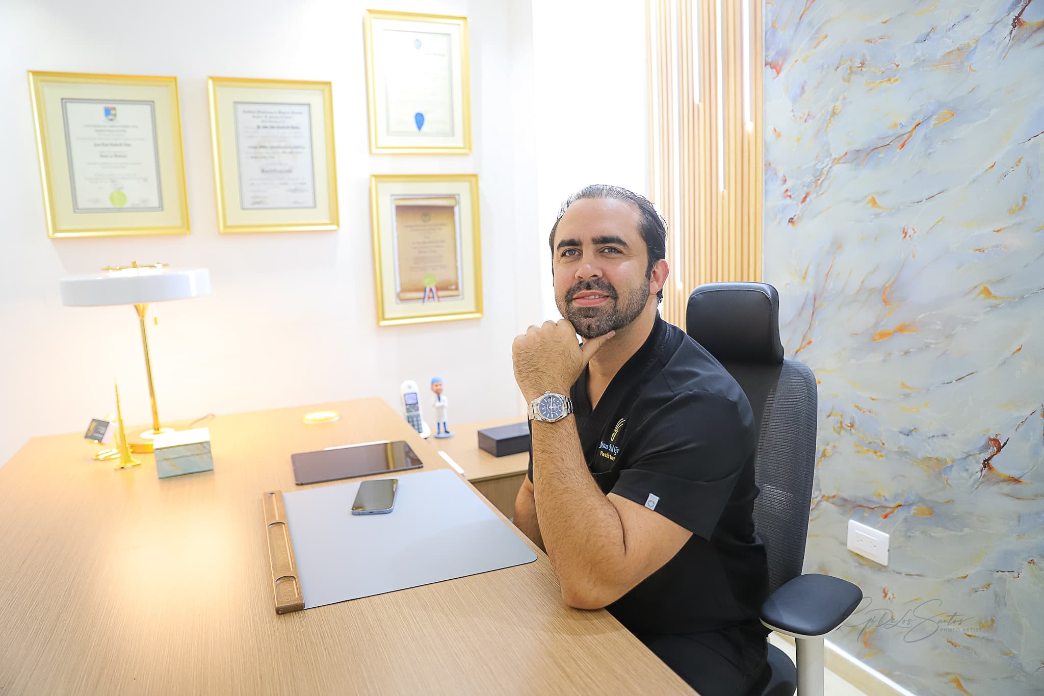 Dr. Jean Paul Giudicelli Saba at his desk in his plastic surgery office in Santo Domingo